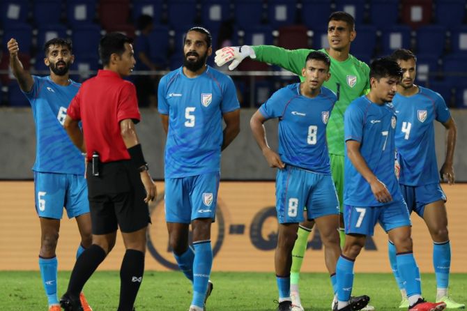 India's players react after Iraq were awarded a debateable penalty