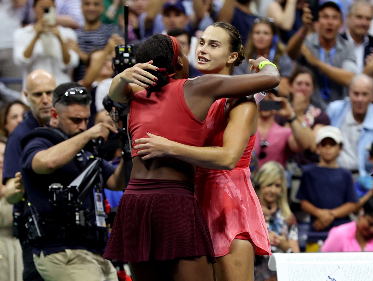 Coco Gauff and Aryna Sabalenka embrace at the net after the final.