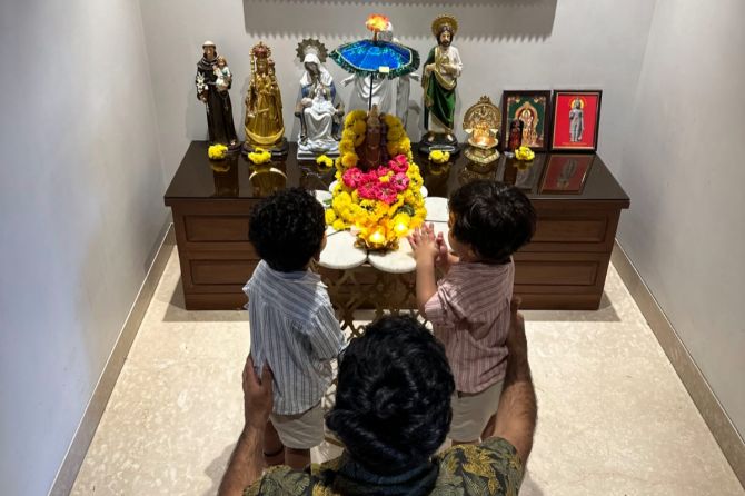 Dinesh Karthik with his twin sons Kabir and Zian as they pray to Lord Ganesh at home