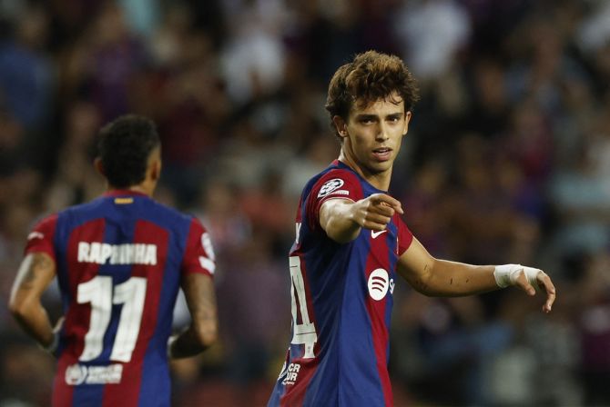 Joao Felix celebrates scoring Barcelona's first goal during the Group H match against Royal Antwerp at Estadi Olimpic Lluis Companys, in Barcelona.