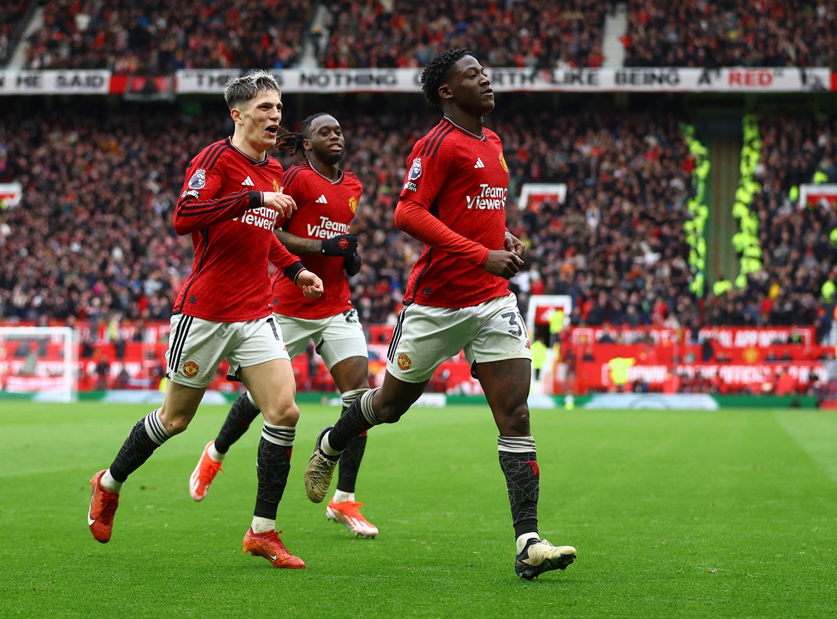Kobbie Mainoo celebrates scoring Manchester United's second goal with Aaron Wan-Bissaka and Alejandro Garnacho.