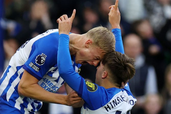 Brighton & Hove Albion's Jack Hinshelwood celebrates scoring their second goal with Jan Paul van Hecke in their match against  Crystal Palace at The American Express Community Stadium, Brighton