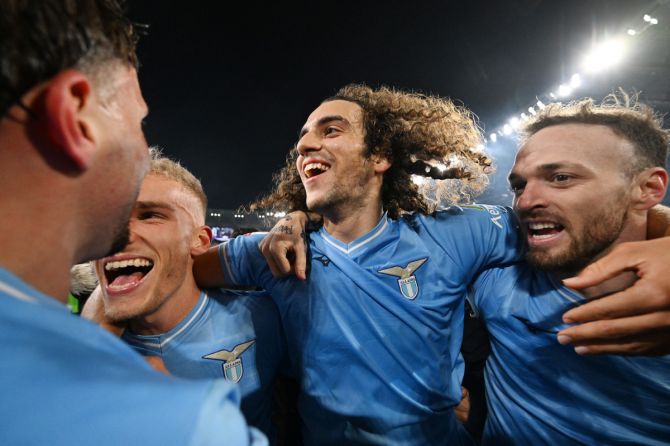 Lazio's Matteo Guendouzi celebrates with teammates after their Coppa Italia quarterfinal win over Roma at Stadio Olimpico, Rome, on Wednesday