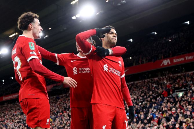 Liverpool's Cody Gakpo celebrates scoring their second goal with Curtis Jones and Darwin Nunez during their League Cup Carabao Cup semi-final first leg match against Fulham at Anfield on Wednesday