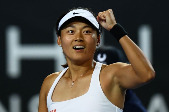 China's Wang Yafan celebrates winning her second round match against Britain's Emma Raducanu 