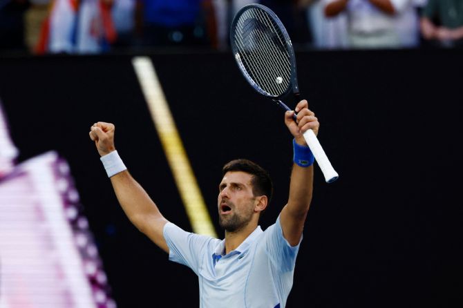 Serbia's Novak Djokovic celebrates after winning his quarter-final match against USA's Taylor Fritz 