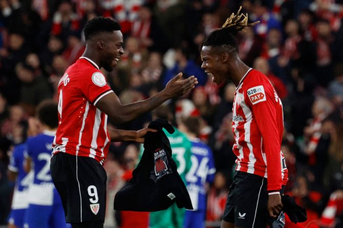 Athletic Bilbao's Inaki Williams celebrates with Nico Williams after their win over Atletico Madrid in the Copa del Rey semi-final second leg match in Bilbao, Spain, on Friday