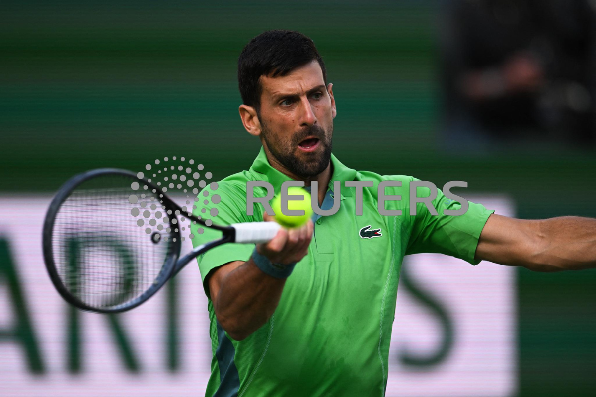 Novak Djokovic plays a return in his second round match against Aleksandar Vukic during the BNP Paribas Open at Indian Wells Tennis Garden at Indian Wells in California, USA on Saturday
