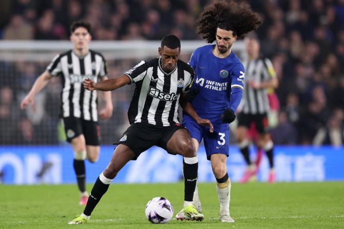 Newcastle United's Alexander Isak in action with Chelsea's Marc Cucurella 