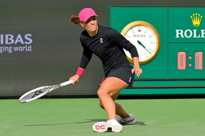 Poland's Iga Swiatek hits a shot during her win over Ukraine's Marta Kostyuk in her semi-final match in the BNP Open at the Indian Wells Tennis Garden. 