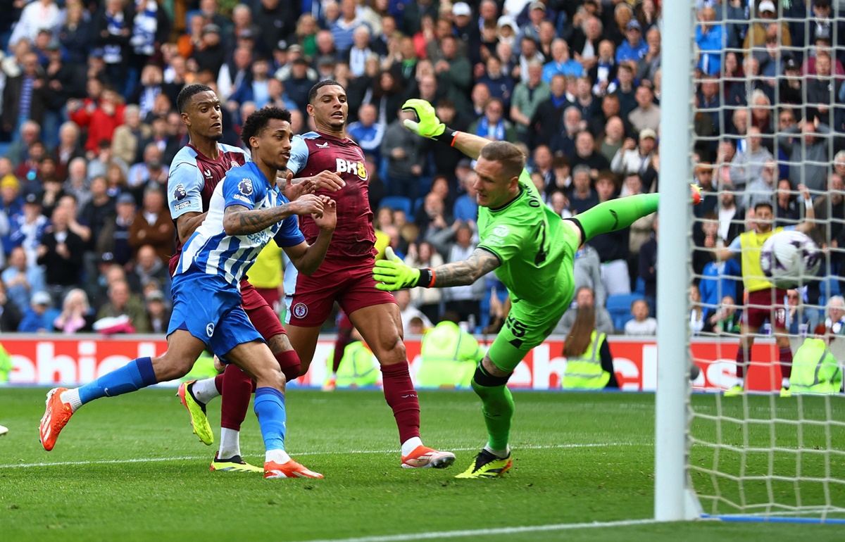 Aston Villa's Robin Olsen saves a penalty from Brighton & Hove Albion's Joao Pedro before Pedro scores off the rebound in the match at The American Express Community Stadium, in Brighton.