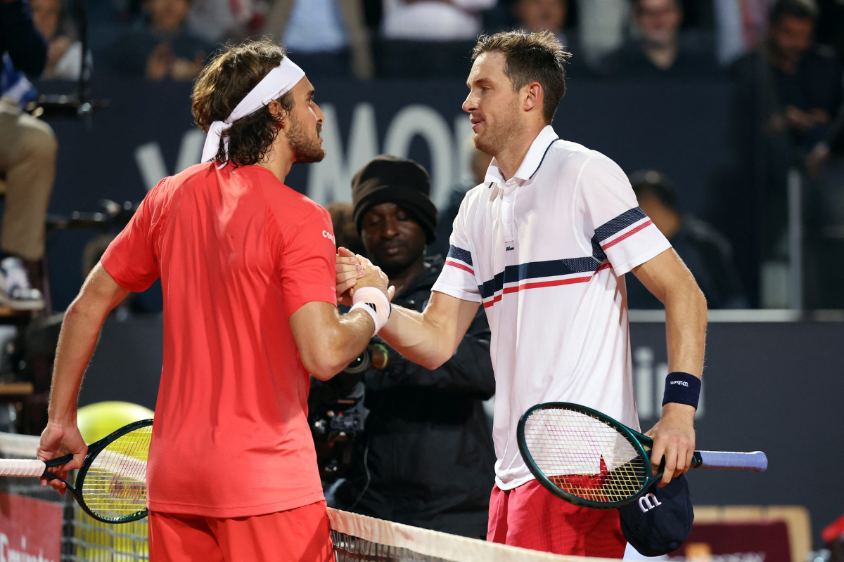 Chile's Nicolas Jarry shakes hands with Greece's Stefanos Tsitsipas after winning his quarter final match at the Italian Open in at Foro Italico in Rome on Thursday