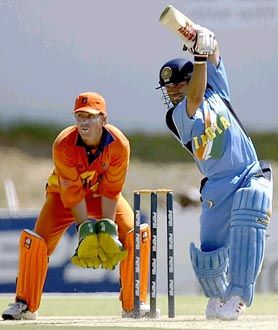 Jeroen Smits, the Holland wicket-keeper, watches Sachin Tendulkar drive on the way to 52. Tendulkar became the World Cup's all-time leading run scorer in the course of India's first World Cup game against Holland at Boland Park, Paarl.