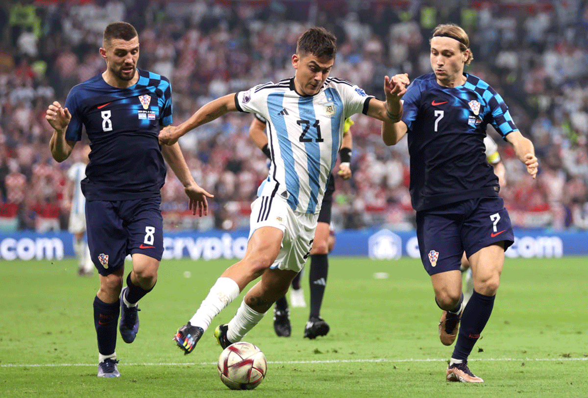 Argentina's Paulo Dybala battles for possession with Croatia's Mateo Kovacic (left) and Lovro Majer