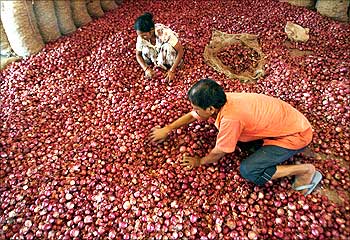 Labourers sort onions at a wholesale market in Siliguri.