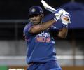 Dhoni century lifts India to victory