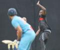 Thunder 'Bolt' hits Bangalore... with cricket bat and ball