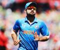 Kohli keeps wickets to give Dhoni a one-over break