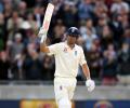 Rain holds up England after Cook makes 243