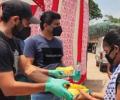 Shami distributes food and water to migrants