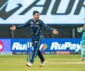 IPL PIX: Rashid, Gill star as GT beat LSG to seal play-off berth