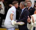 Heartwarming! Root hugs father after historic century