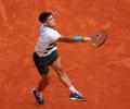 Alcaraz rallies to move into French Open quarter-finals