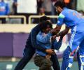 Drama as fan breaches security to touch Kohli's feet!
