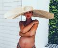 Amy Jackson goes topless, flaunts her baby bump