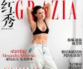 Alessandra shows serious abs on mag cover