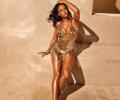 Rihanna reveals svelte bod in a gold strappy dress