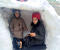 Enjoying Hot Tea In A Frozen Igloo