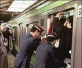 New jobs: Pushing commuters into trains!