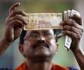 Re fails to maintain initial gains, down 16 paise vs dollar