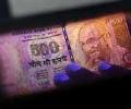 Rupee down 30 paise against dollar in late morning trade