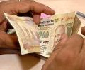 As rupee sinks, NRIs take loans to remit money