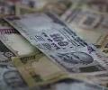 Rupee at two-week low, slumps 35 paise