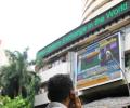 Markets end tad higher led by banks; metals falter