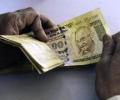 Rupee ends at over 1-month low, down 8 paise