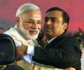 One year of Modi govt: Ambanis lose, Adani gains in stock market