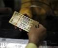 Rupee gains 5 paise against dollar