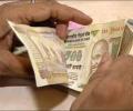 Rupee ends little changed; debt Inflows continue