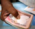 Rupee ends marginally higher; importer demand limits gains