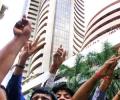 Market ends at record highs; Sensex tops 25,000