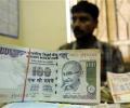 Rupee washes out initial losses vs dollar