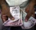 RBI nudges rupee weaker, as other currencies slide faster