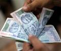 Rupee falls to 4-week low at 64.08