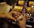 Gold, silver prices stay flat in thin trade