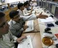 Markets end higher led by SBI; Sensex up 293 points