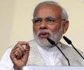 Modi says India won't join forex devaluation race to boost trade